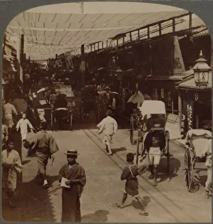 Mid-summer traffic under awnings of Shiro-bashidori, a busy thoroughfare of Kyoto, Japan Mid-summer traffic under awnings of Shiro-bashidori, a busy thoroughfare of Kyoto, Japan