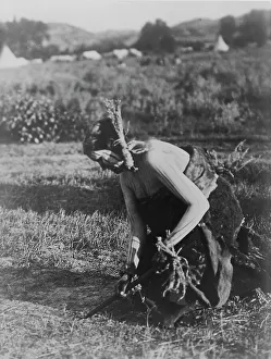 Edward Curtis Images Prints: Offering the pipe to the Earth-Cheyenne, c1910. Creator: Edward Sheriff Curtis