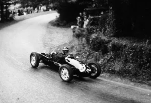 Vintage Motor Sport Images Prints: A racing driver speeding round a bend
