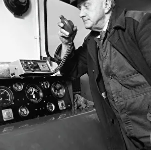 Black And White Train Photos Prints: Train driver on an intercom, South Yorkshire, 1964. Artist: Michael Walters