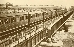 Black And White Train Images Prints: A Train Passing Over The Bridge, c1930. Creator: Unknown