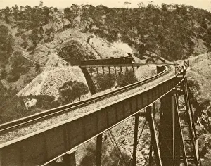 Steam Locomotive Pictures Prints: Train Passing Over Viaduct, Mount Lofty Range, South Australia, 1930. Creator: Unknown