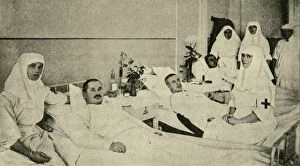 Alix Of Hesse Collection: Tsarina Alexandra nursing wounded soldiers, 1914, (c1920). Creator: Unknown