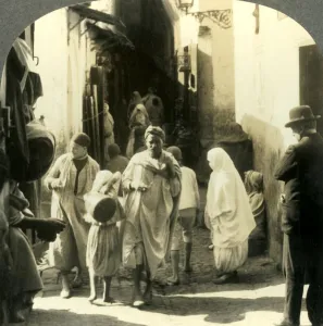 Turbaned Men and Veiled Women Crowd this Narrow Street in the Arab Quarter of Algiers Turbaned Men and Veiled Women Crowd this Narrow Street in the Arab Quarter of Algiers