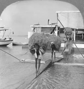 Monochrome Black And White Image Prints: Unloading a vessel on the Irrawaddy River, Burma, 1908. Artist: Stereo Travel Co