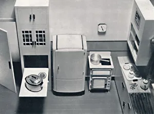 Retro Kitchen Decor Prints: View of a kitchen, designed by H. M. V. Household Appliances, 1938