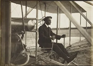 Wilbur Wright Prints: Wilbur Wright in the flyer, 1908. Creator: Anonymous