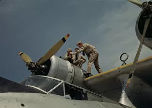 Airscrew Collection: Working on a plane at the Naval Air Base, Corpus Christi, Texas, 1942. Creator: Howard Hollem