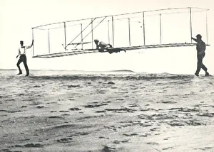 Prints of Wright Brothers Glider Tests, Kill Devil Hills, North Carolina, USA, October 10, 1902. Historic photo of the Wright brothers third test glider being launched Wright Brothers Prints: Wright Brothers Glider Test Print, October 10, 1902