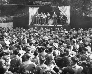 Britain At War Prints: Print of soldiers on stage entertaining fellow troops, 9 October 1939