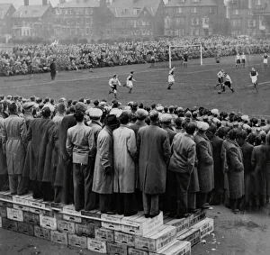 Fans standing on boxes to watch the FA Cup Tie at Great Yarmouth FC football ground 1953 Fans standing on boxes to watch the FA Cup Tie at Great Yarmouth FC football ground 1953