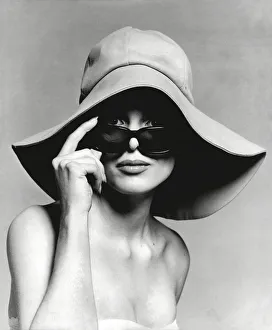 Model wearing floppy hat and sunglasses Model wearing floppy hat and sunglasses