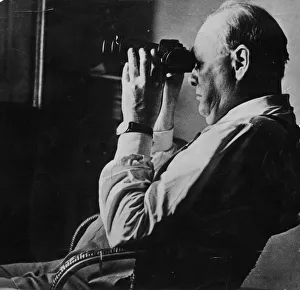 Sir Winston Churchill looking through a set of binocular Sir Winston Churchill looking through a set of binocular