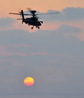 Army Air Corps Apache Helicopter Over Sunset in Mediterranean Sea Army Air Corps Apache Helicopter Over Sunset in Mediterranean Sea