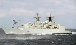 HMS Cornwalls Lynx Helicopter Flies Over HMS Cumberland in the Indian Ocean HMS Cornwalls Lynx Helicopter Flies Over HMS Cumberland in the Indian Ocean