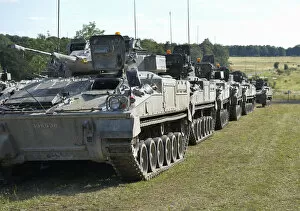 Army Collection: A line of Warrior vehicles wait for a call to action on Salisbury Plain during Exercise Lion Strike