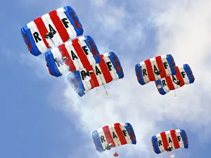 Parachutists from the Royal Air Forces Falcons Display Team, drift gently back Parachutists from the Royal Air Forces Falcons Display Team, drift gently back