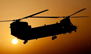 A RAF Chinook Helicopter Takes Off on a Dawn Mission Over Helmand, Afghanistan A RAF Chinook Helicopter Takes Off on a Dawn Mission Over Helmand, Afghanistan