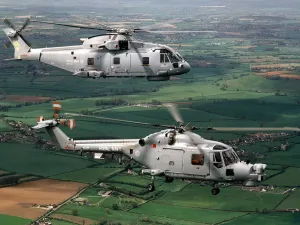 A Royal Navy Merlin (top) and Lynx Mk 8 helicopter A Royal Navy Merlin (top) and Lynx Mk 8 helicopter