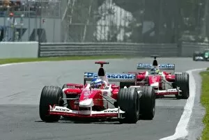 Images Dated 15th June 2003: Formula One World Championship: Eighth placed Olivier Panis Toyota TF103 leads team mate Cristiano