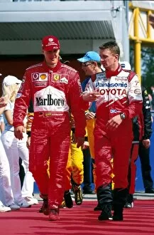 Images Dated 16th April 2002: Formula One World Championship: Toyotas Allan McNish, right, chats with F1 World Champion Michael