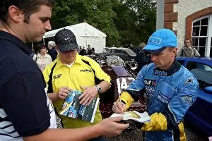 Images Dated 23rd September 2003: Mount Stuart Classic: Renault test driver Allan McNish signs autographs for the fans