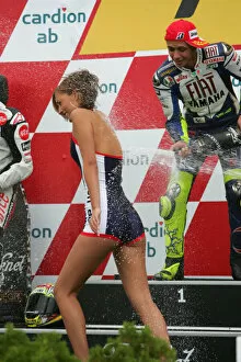 Images Dated 17th August 2008: Valentino Rossi Fiat Yamaha Team sprays the podium girl with his champagne