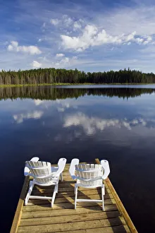 Adirondack Chairs On Dock, Two Mile Lake, Duck Mountain Provincial Park, Manitoba Adirondack Chairs On Dock, Two Mile Lake, Duck Mountain Provincial Park, Manitoba