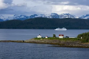 Aerial View Of Point Retreat Light House At The Tip Of Mansfield Penninsula With Admiralty Island And A Cruise Ship In Aerial View Of Point Retreat Light House At The Tip Of Mansfield Penninsula With Admiralty Island And A Cruise Ship In