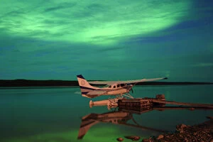 Images Dated 22nd January 2012: Aurora Borealis Or Northern Lights Over Float Plane And Mackenzie River, Fort Simpson