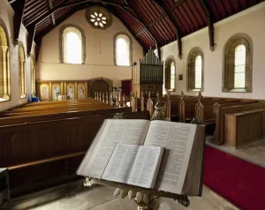 The Bible Open On A Stand At The Back Of Howick Church; Northumberland, England The Bible Open On A Stand At The Back Of Howick Church; Northumberland, England