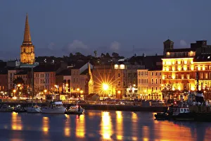 Boats Moored On River Suir At City Waterfront At Night; Waterford City, County Waterford, Ireland Boats Moored On River Suir At City Waterfront At Night; Waterford City, County Waterford, Ireland