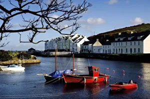 Boats Moored At A Riverbank With Buildings In The Background, Cushendun, County Antrim Boats Moored At A Riverbank With Buildings In The Background, Cushendun, County Antrim