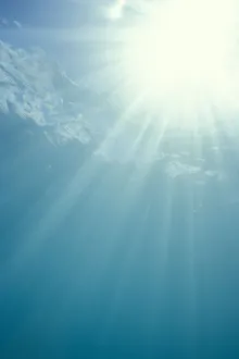 Brilliant Sunburst Through Water Surface With Sunrays, View From Underwater Brilliant Sunburst Through Water Surface With Sunrays, View From Underwater