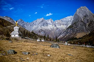 Buddhist prayer flags and stupa in the mountains, Mount Siguniang National Park; Ngawa Prefecture, Sichuan, China Buddhist prayer flags and stupa in the mountains, Mount Siguniang National Park; Ngawa Prefecture, Sichuan, China