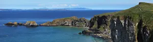 Carrick-A-Rede Rope Bridge In The Distance; Ballintoy, County Antrim, Northern Ireland Carrick-A-Rede Rope Bridge In The Distance; Ballintoy, County Antrim, Northern Ireland
