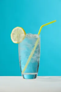 Clear Glass Of Water With Lemon And Drinking Straw Clear Glass Of Water With Lemon And Drinking Straw
