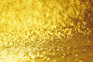Closeup Of Golden Shimmering Reflections Off Water Closeup Of Golden Shimmering Reflections Off Water