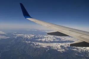 A Commercial Jet Flies Over The Mountains Of The American West; Colorado, United States Of America A Commercial Jet Flies Over The Mountains Of The American West; Colorado, United States Of America