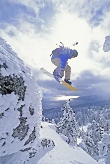 Diamond Peak, Lake Tahoe, Nevada, Usa; Man Snowboarding In Mid-Air Diamond Peak, Lake Tahoe, Nevada, Usa; Man Snowboarding In Mid-Air