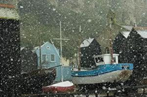 Images Dated 1st January 2010: England, East Sussex, Fishing boats covered with snow in old town; Hastings