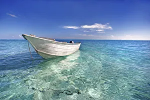 French Polynesia, Tahiti, Bora Bora, White Boat Floating On Turquoise Water French Polynesia, Tahiti, Bora Bora, White Boat Floating On Turquoise Water