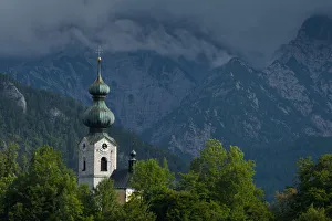 Germany, Stormy clouds behind Ruhpolding church; Bavaria Germany, Stormy clouds behind Ruhpolding church; Bavaria