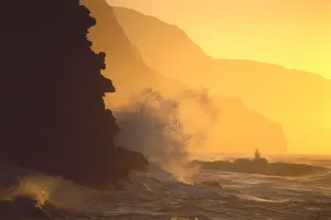 Hawaii, Kauai, Na Pali Coast At Sunset From Haena, Crashing Waves Against Rocks, Misty Yellow Sky Hawaii, Kauai, Na Pali Coast At Sunset From Haena, Crashing Waves Against Rocks, Misty Yellow Sky