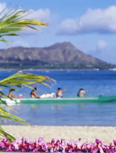Hawaii, Oahu, Waikiki, Diamond Head, Canoe Paddlers With Orchid Lei In The Foreground Hawaii, Oahu, Waikiki, Diamond Head, Canoe Paddlers With Orchid Lei In The Foreground