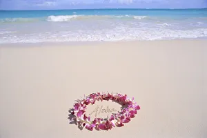 Hawaii, Purple Orchid Lei, Aloha Written In The Sand, Turquoise Ocean Background Hawaii, Purple Orchid Lei, Aloha Written In The Sand, Turquoise Ocean Background