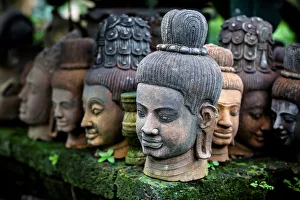 Heads Of Statues Of Buddha Are Stacked In A Terra-Cotta Factory; Chiang Mai, Thailand Heads Of Statues Of Buddha Are Stacked In A Terra-Cotta Factory; Chiang Mai, Thailand