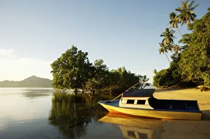 Indonesia, Sulawesi, Boat on Sandy Beach; Bunaken Indonesia, Sulawesi, Boat on Sandy Beach; Bunaken