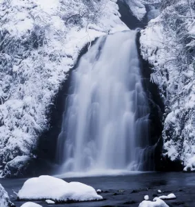 Low Angle View Of A Waterfall, Glenoe Waterfall, Glenoe, County Antrim, Northern Ireland Low Angle View Of A Waterfall, Glenoe Waterfall, Glenoe, County Antrim, Northern Ireland