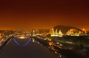 Millenium Bridge And The City Illuminated At Night; Newcastle Northumberland England Millenium Bridge And The City Illuminated At Night; Newcastle Northumberland England
